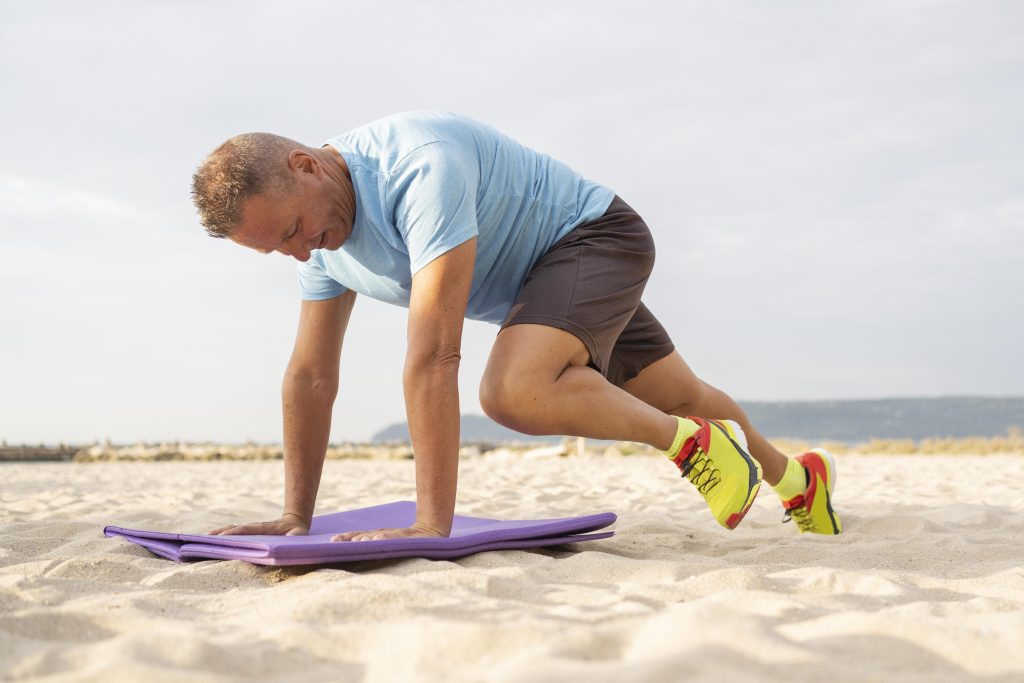 elder-man-working-out-beach